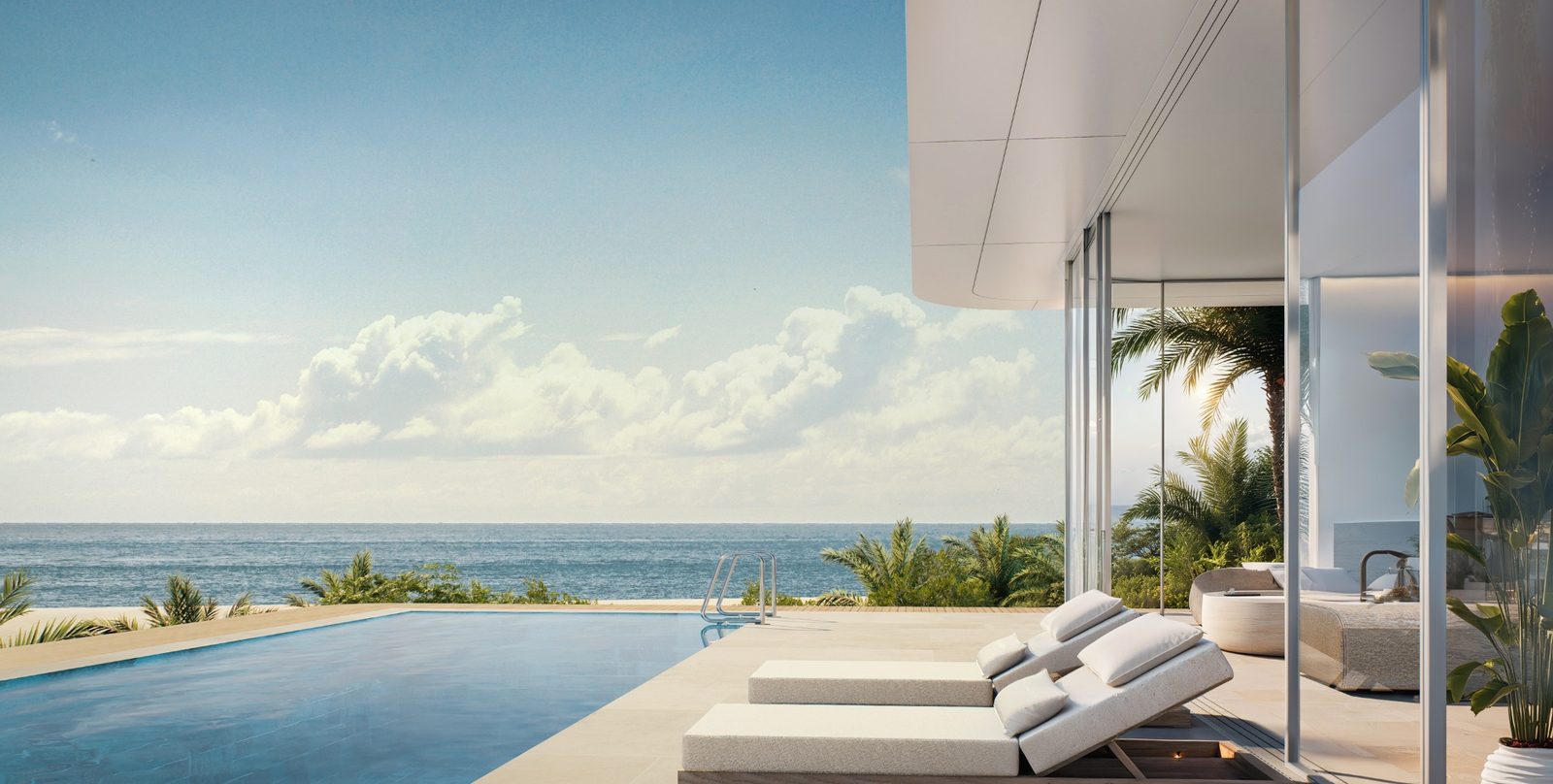 The Crest Residences — infinity pool and sun loungers by the sea